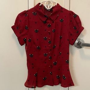 Black cat button up top with peplum